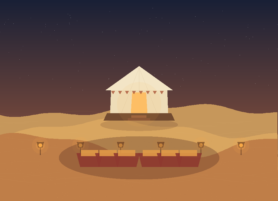 Night dining setup with lanterns at a Jaisalmer desert camp