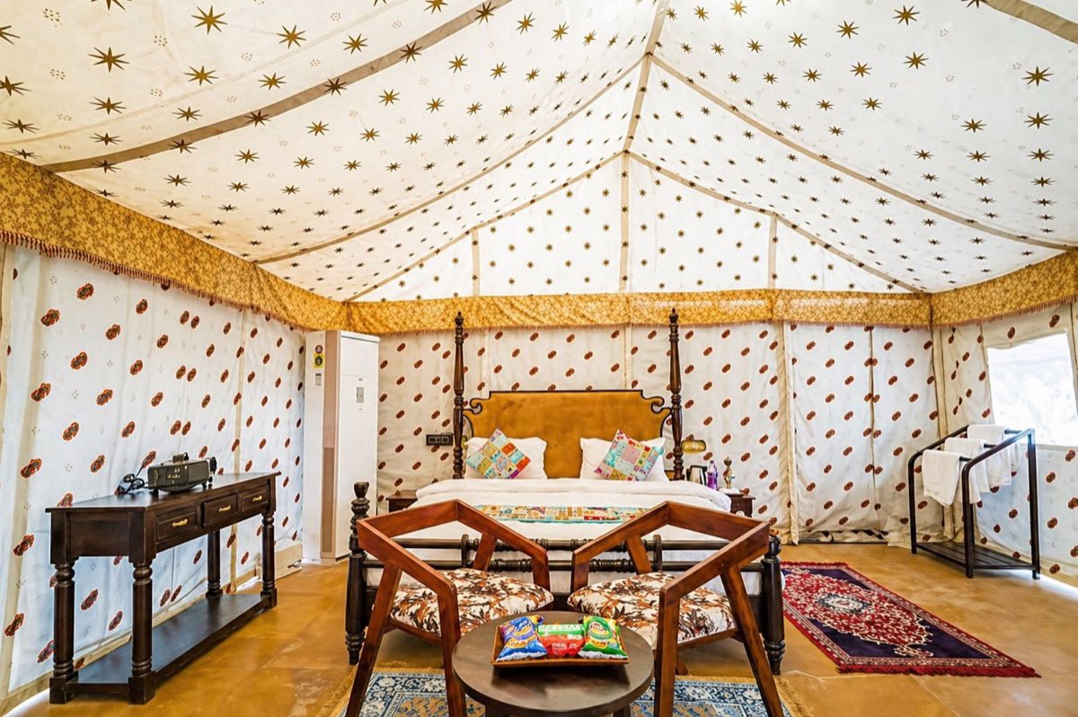 Luxury Swiss tent room with king bed and Rajasthani decor